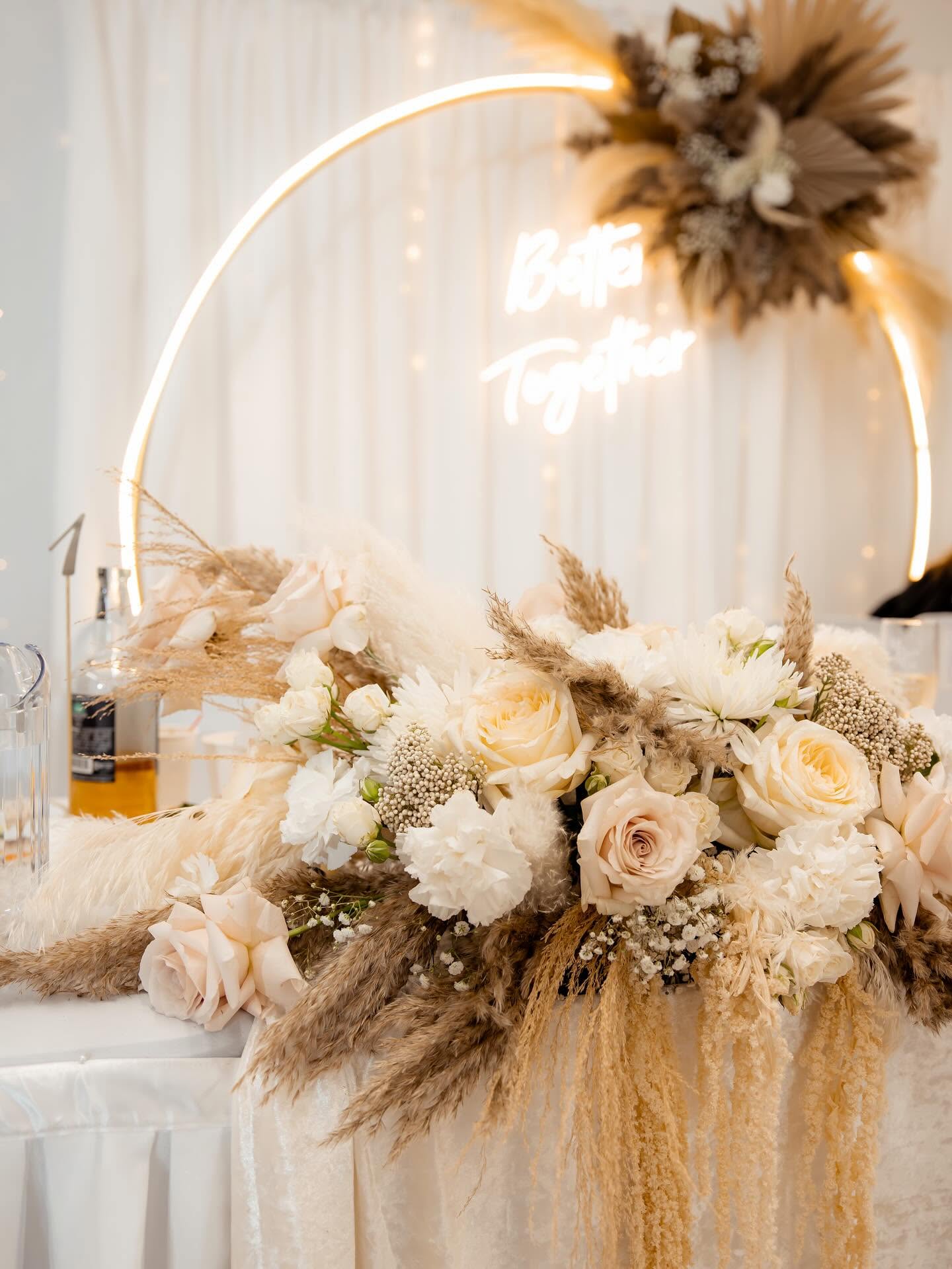 Floral wedding arch with boho decor